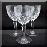G49. 12 Cut crystal white wine goblets. Marked with M. (Waterford Marquis) 8”h - $120 